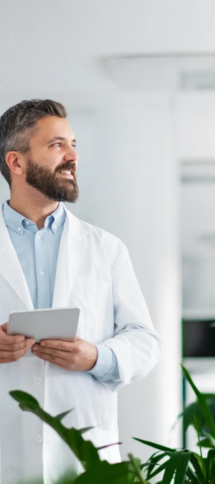 a man holding a tablet