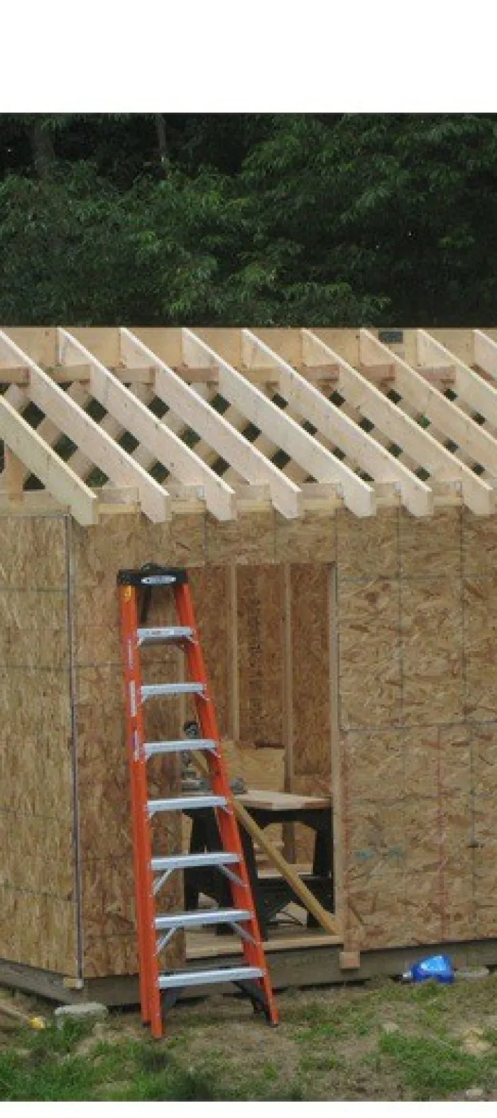 a ladder next to a wooden building