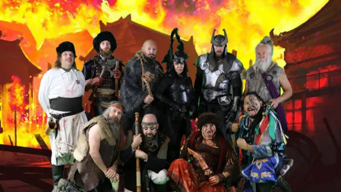 a group of people standing around a fire