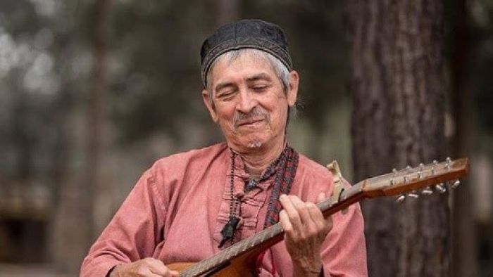 a man holding a stick
