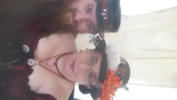 a person wearing a hat and glasses