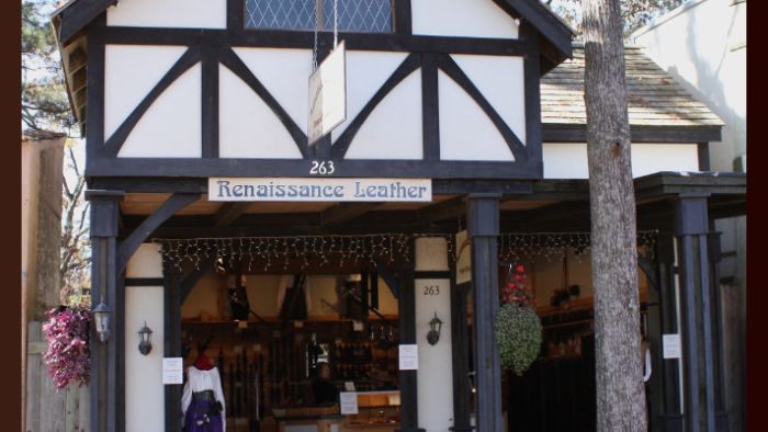 a couple of people that are standing in front of a building