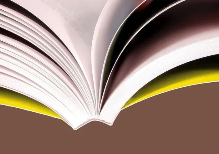 Close-up of an open softcover book bound with PUR adhesive