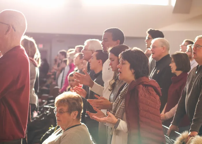 a group of people standing in front of a crowd