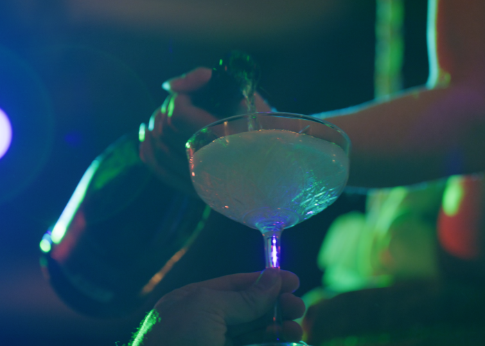 a person holding a glass