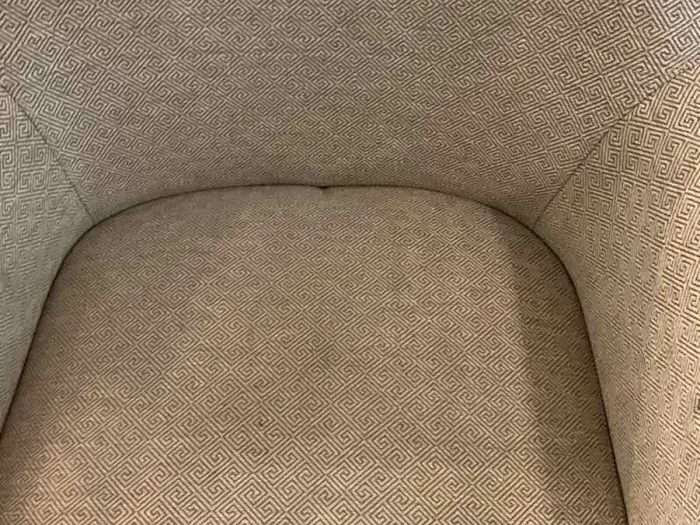 close up of a white textured upholstered chair after it was cleaned by Zerorez