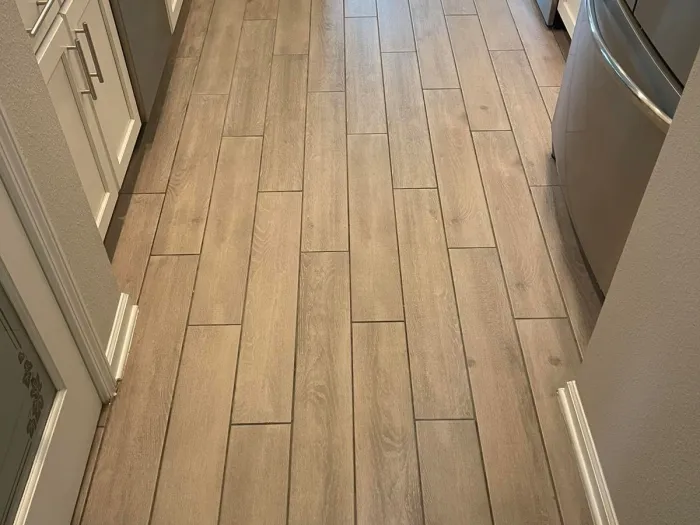 a hardwood floor in a kitchen super clean and smooth after Zerorez cleaned it