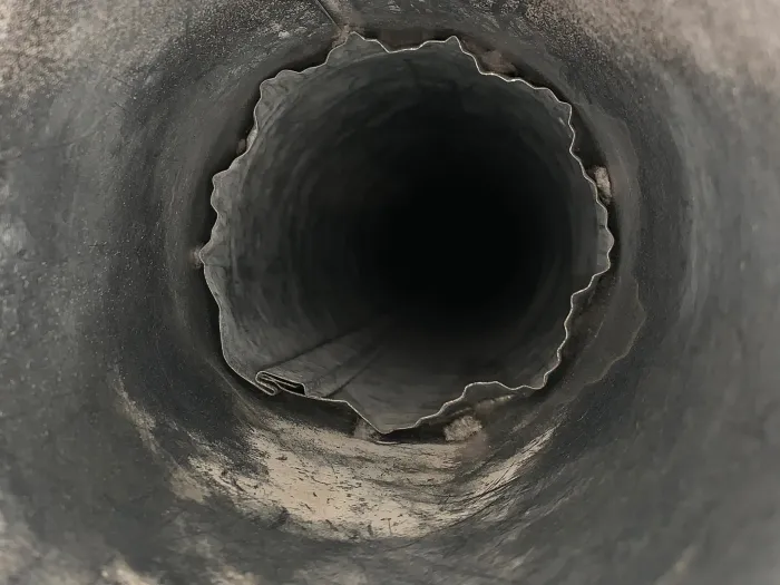 inside closeup of a dryer vent after it was professionally cleaned by Zerorez, removing lint and feathers