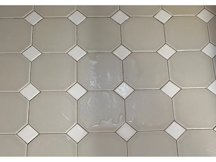 square tiles with white diamonds at the corners flooring with freshly cleaned, now white, grout lines