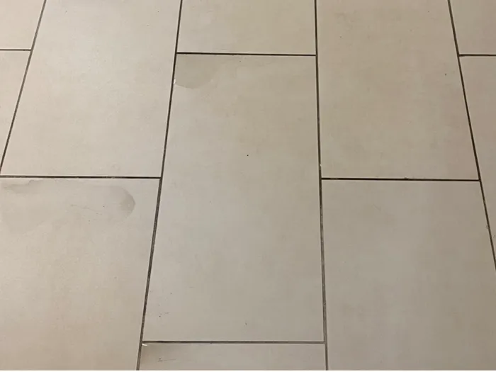 a group of grey floor tiles after cleaning