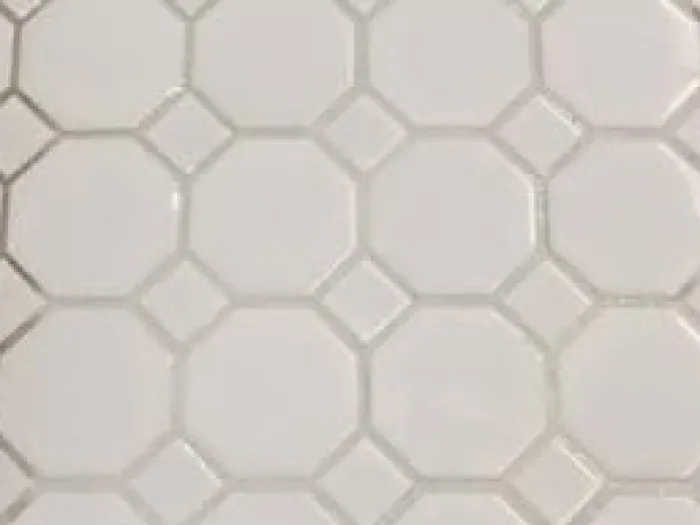 close up of octagon white floor tiles with diamonds in the corner with bright white grout lines after professional tile and grout cleaning from Zerorez