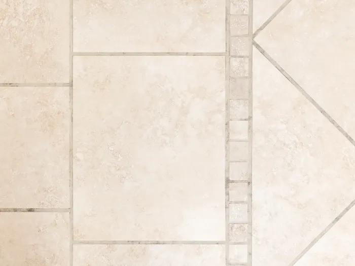 close up, top down view of a beige tile floor with newly cleaned grout lines from Zerorez