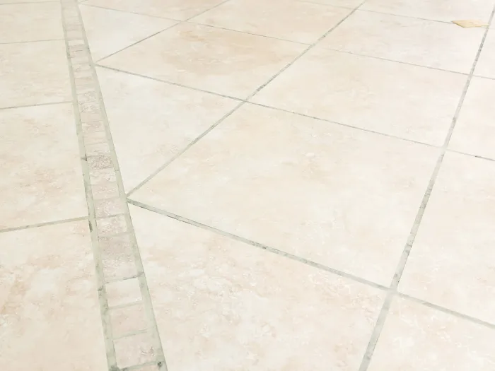 a tiled floor with a diagonal square detail with freshly cleaned grout and tile from Zerorez