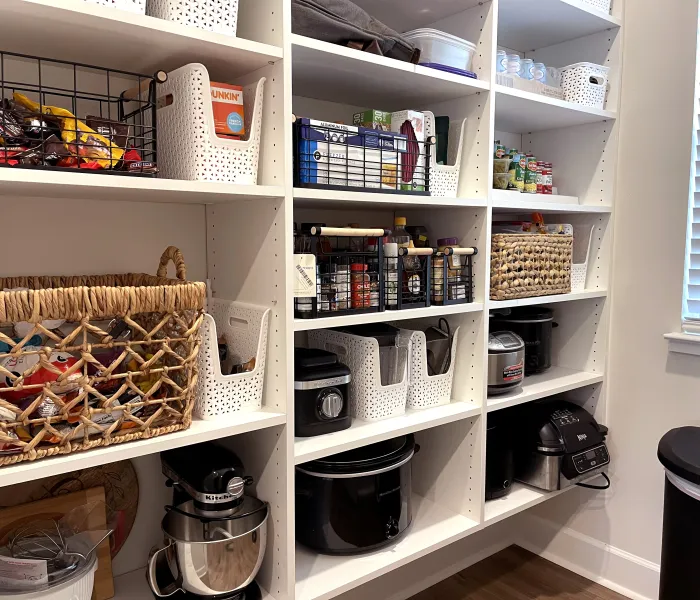 a white shelving unit with various items on it