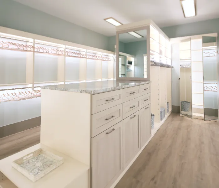 a large kitchen with white cabinets