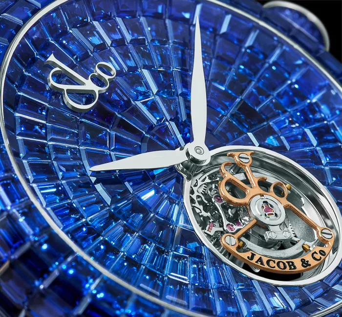 a large blue clock sitting on top of a watch