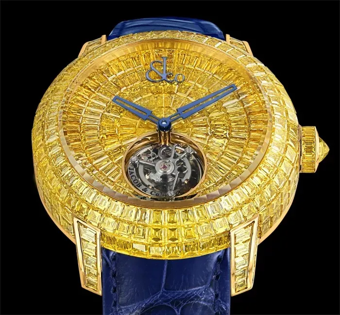 a gold watch with a blue face