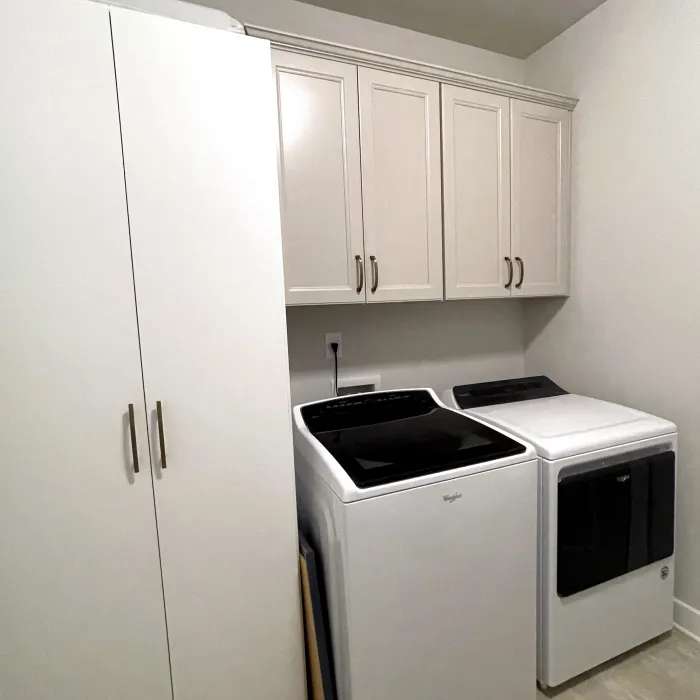 a kitchen with white cabinets