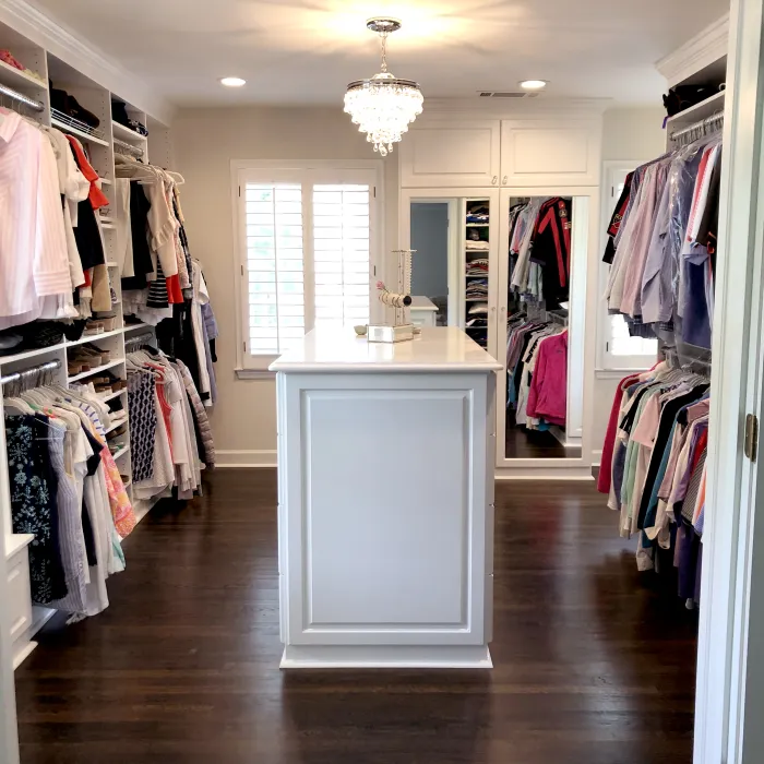 a room with a large closet and a large mirror