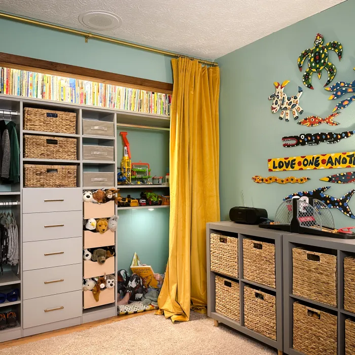 a room with a cabinet and a shelf with objects on it