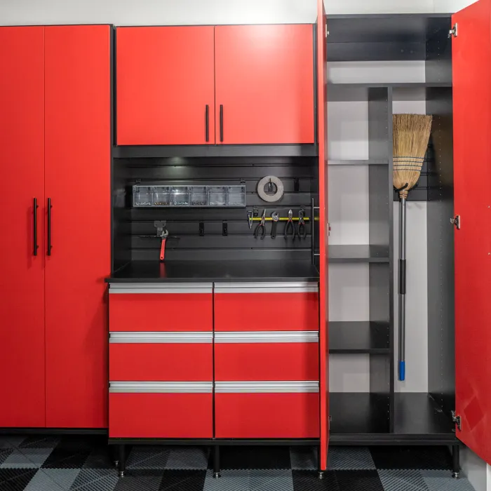 a kitchen with red cabinets