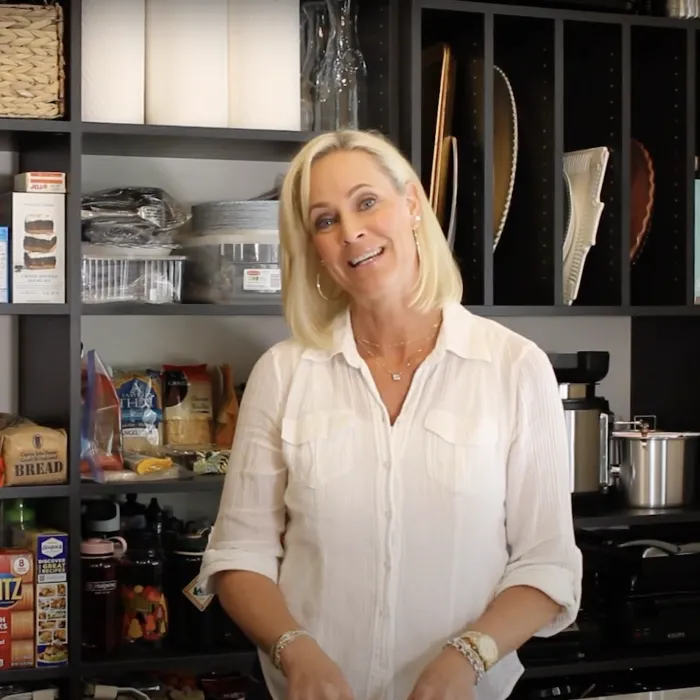 a person standing in a kitchen