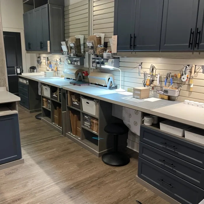 a kitchen with black cabinets