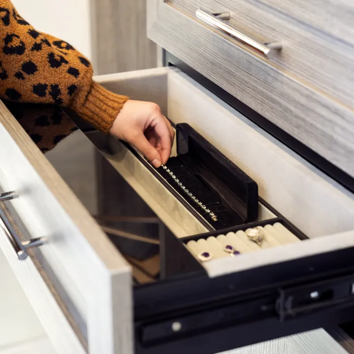 a person opening a drawer