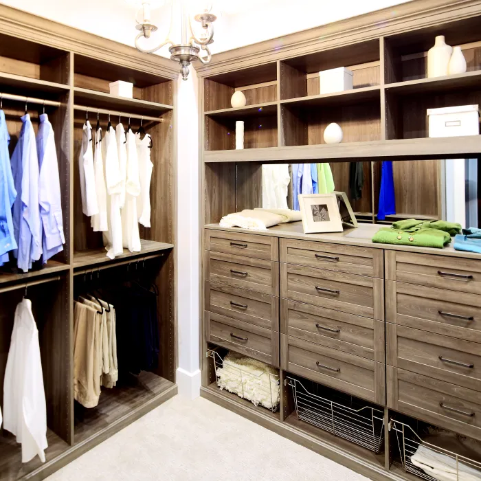 a closet with clothes and a mirror