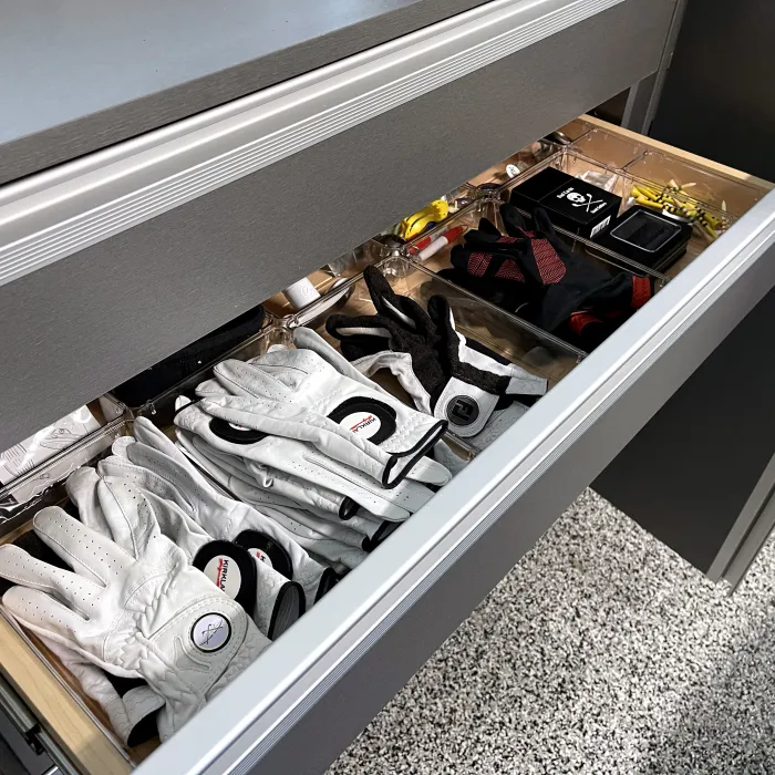 a custom garage drawer full of golf supplies