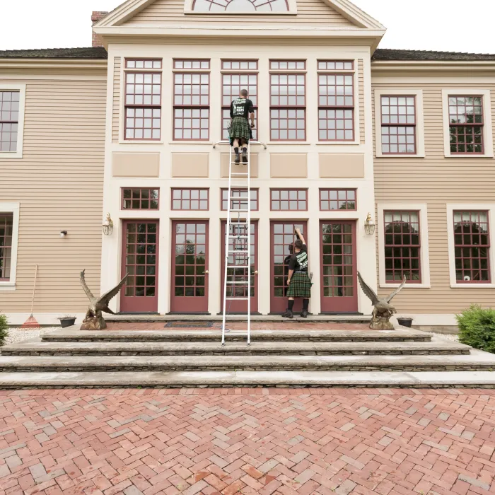 a person standing on the steps of a building