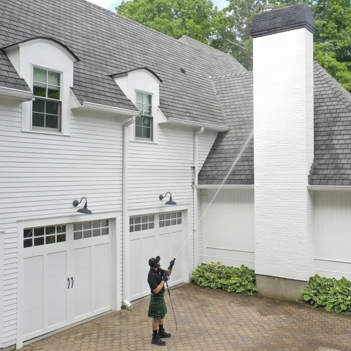 a person standing in front of a house