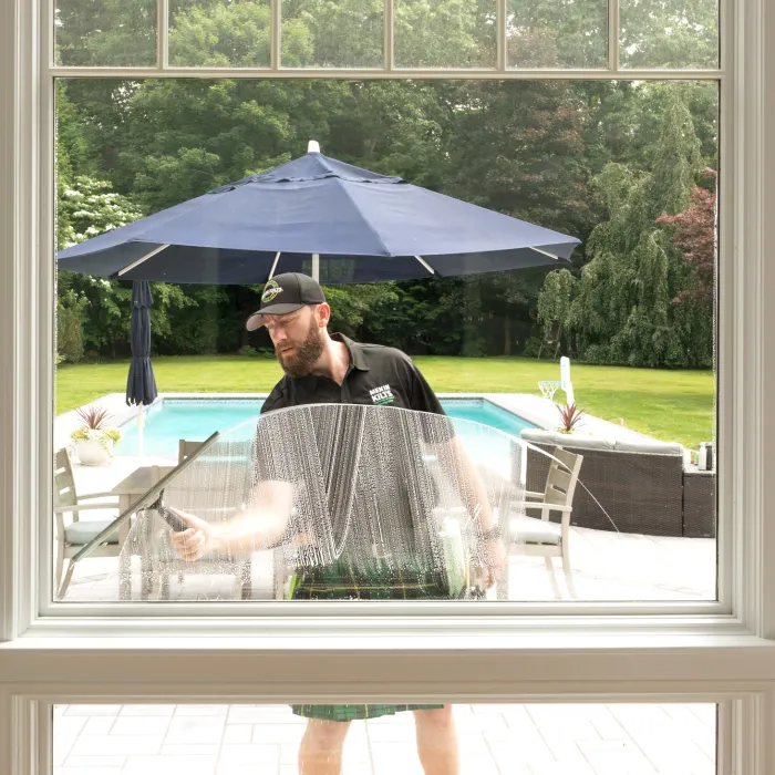 a person cleaning a window