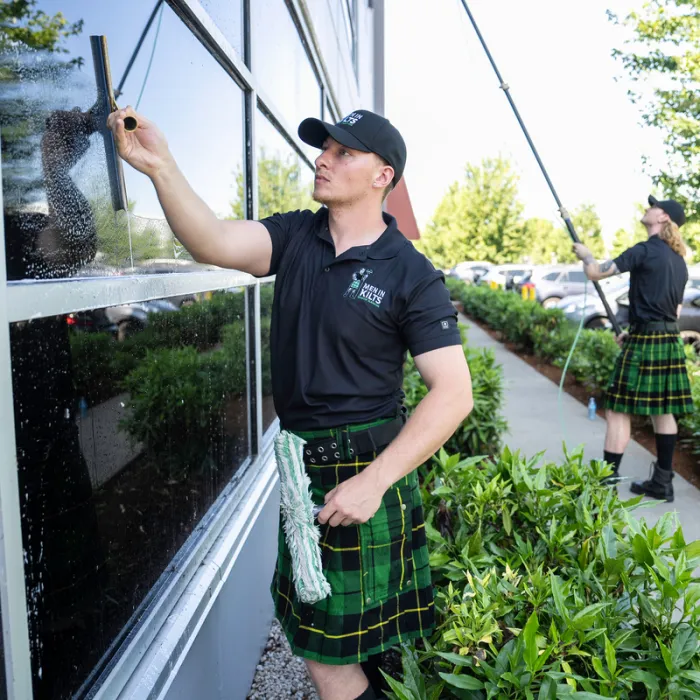 a person in a kilt holding a gun