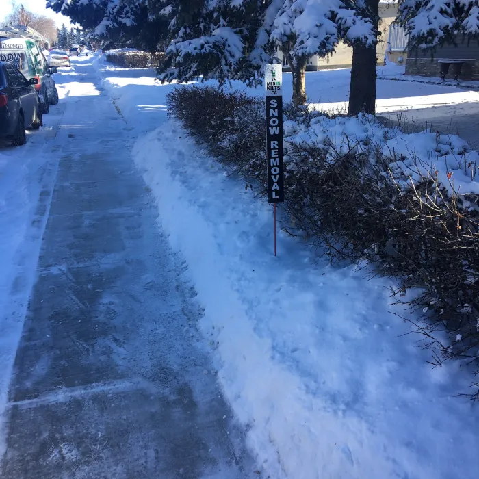 a road with snow on the side