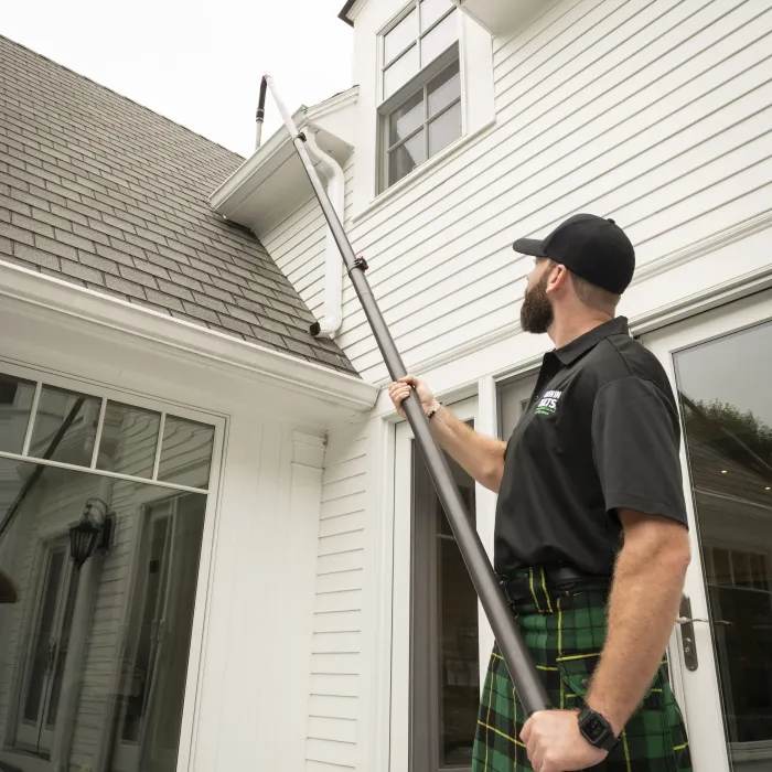 cleaning a gutter