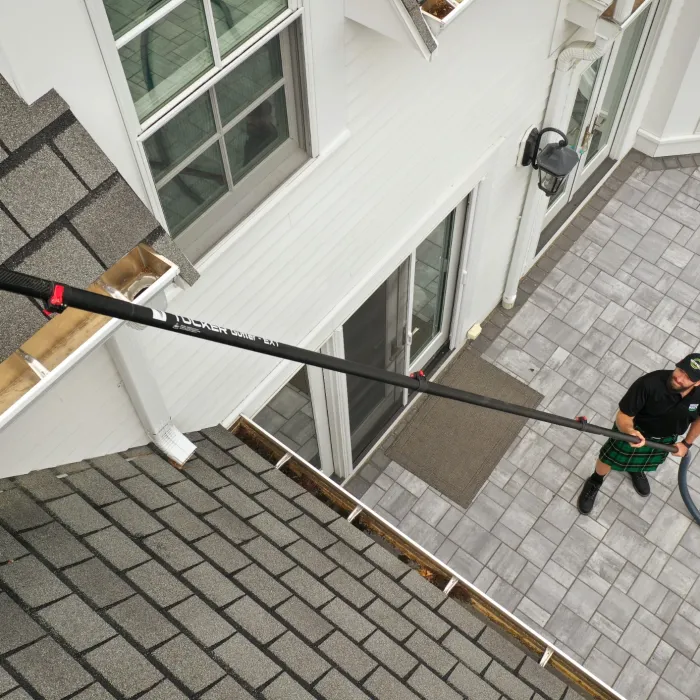 a person with a dog on a leash on a patio