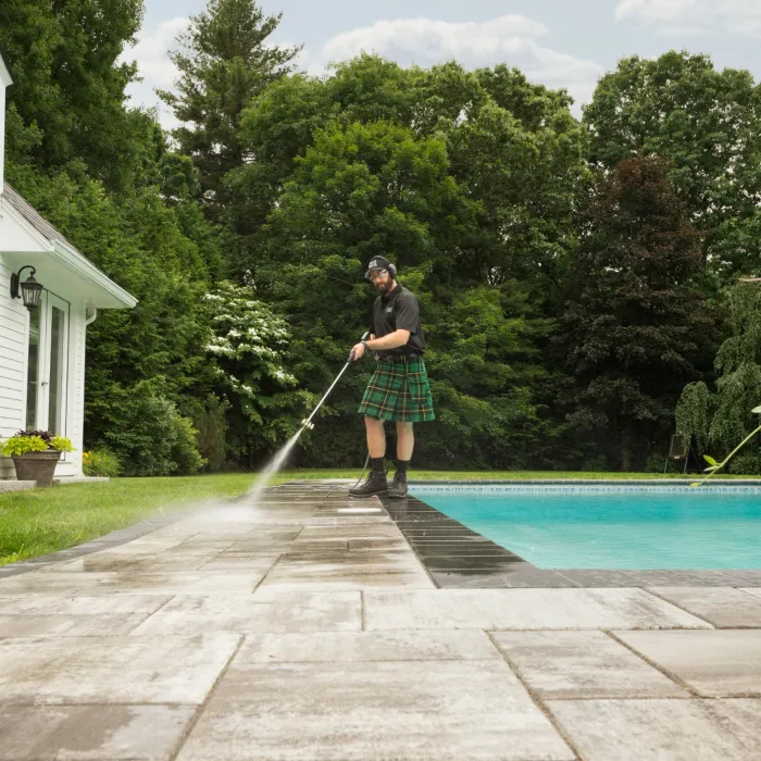 a person standing by a pool