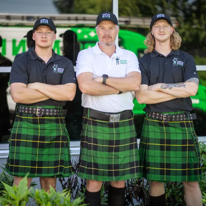 a group of men in kilts