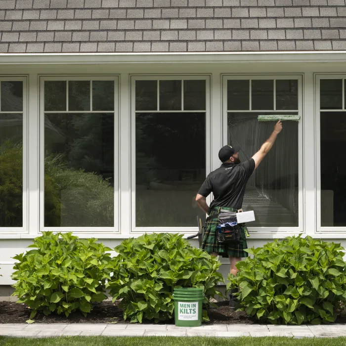 a man standing outside a house