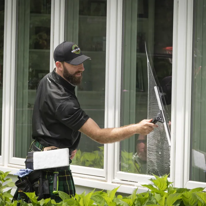 a man washing a window