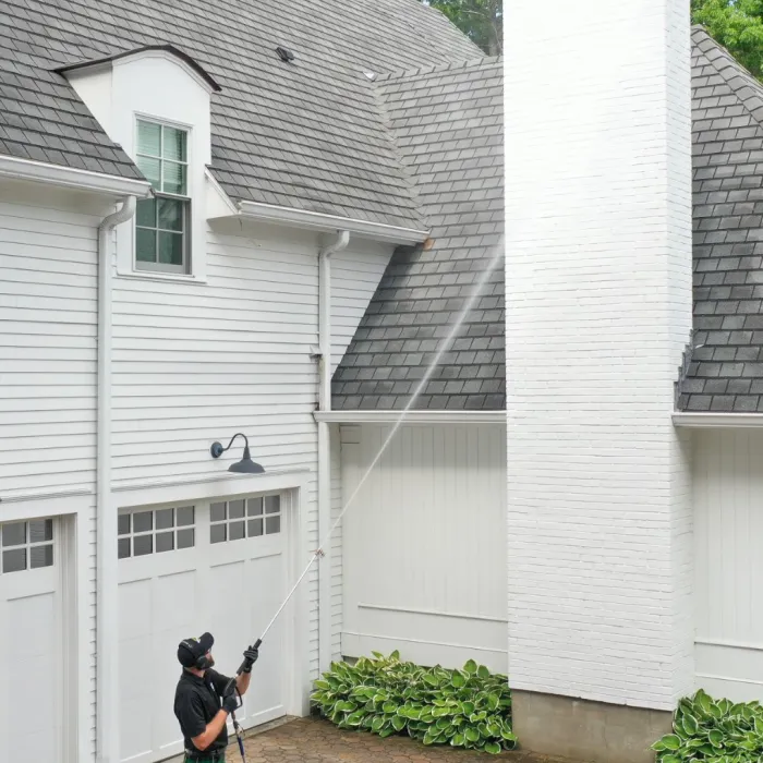 a person standing outside a house