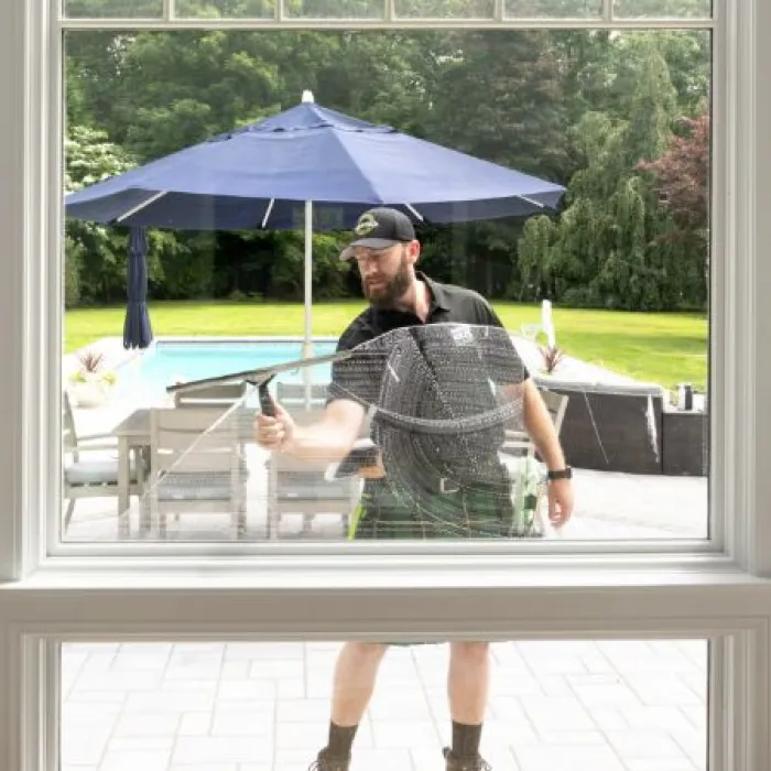 a man cleaning a window