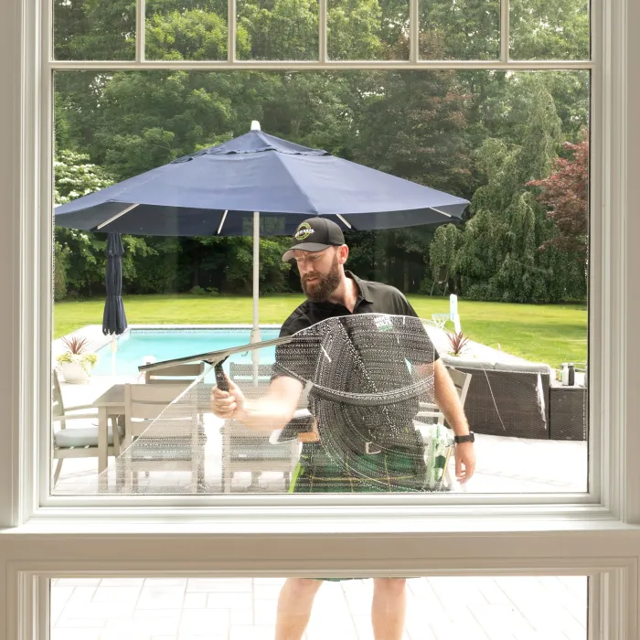 a person washing a window