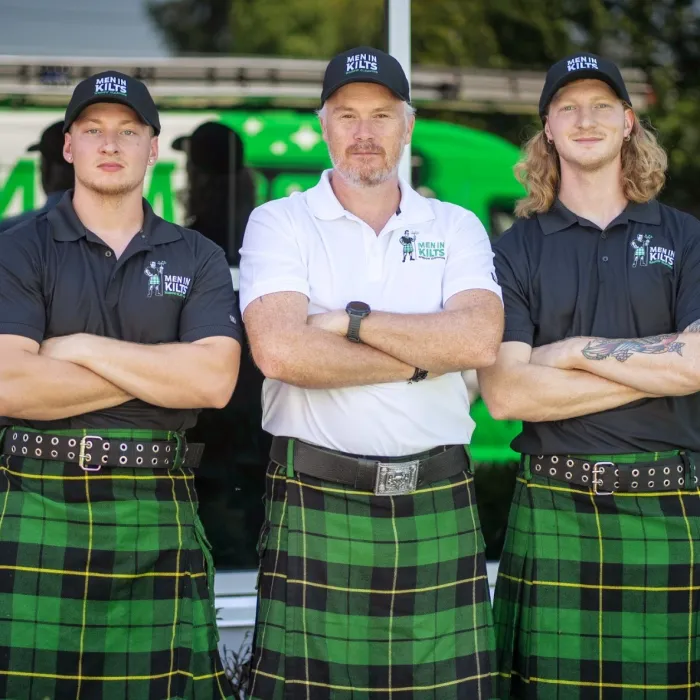 a group of men in kilts