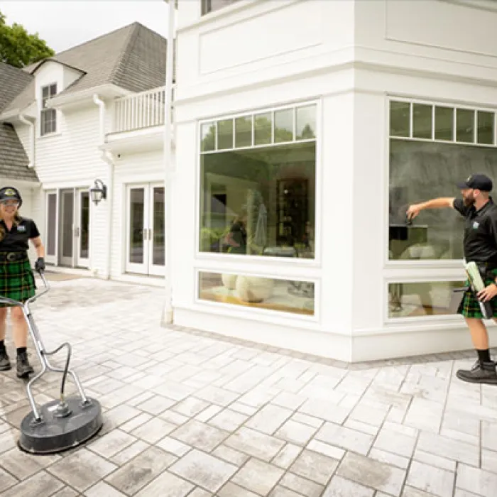 a man and a woman outside a house