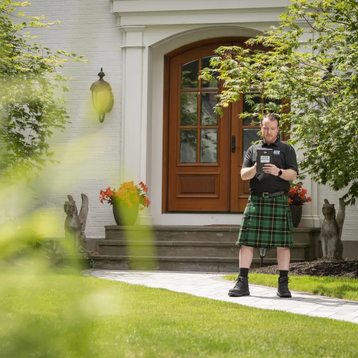 a person standing outside a house