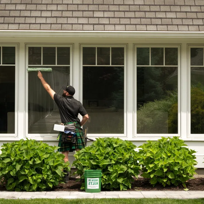 a man standing outside a house