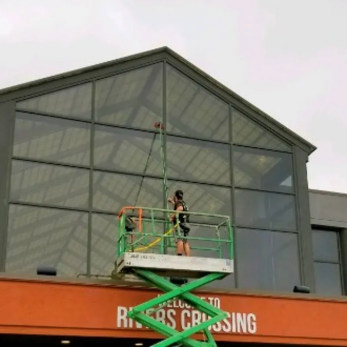 a person on a green and yellow roller coaster