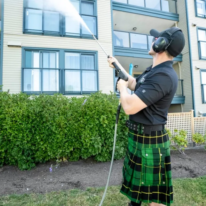 a person wearing a kilt and holding a gun